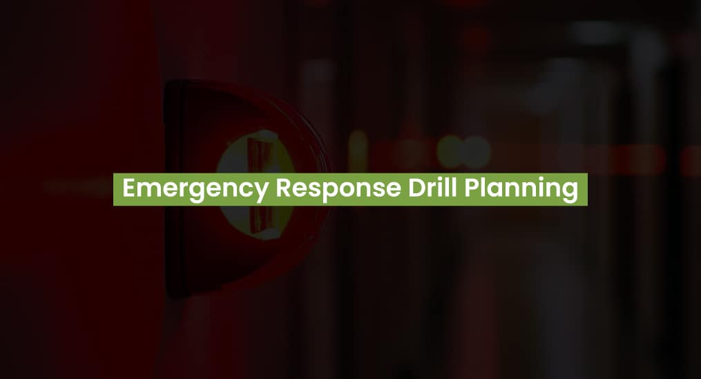 Red fire alarm with text "Emergency Response Drill Planning." Focuses on emergency response drill planning.